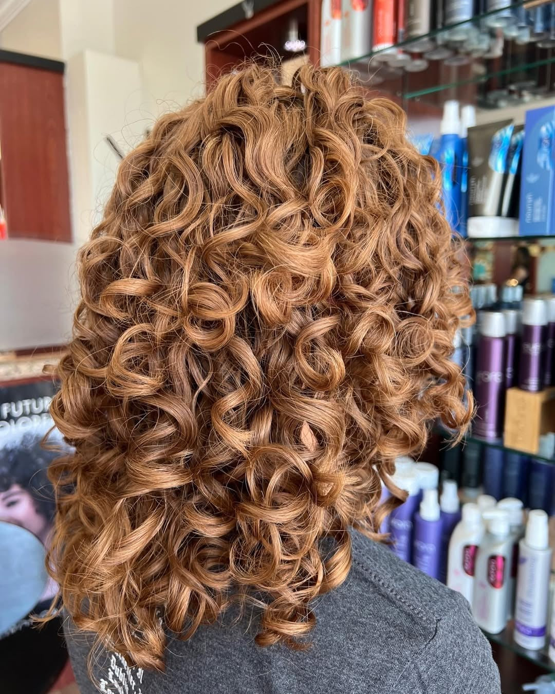 Copper spiral curls cut and diffused at The Cutting Edge Hair Design, Commack NY
